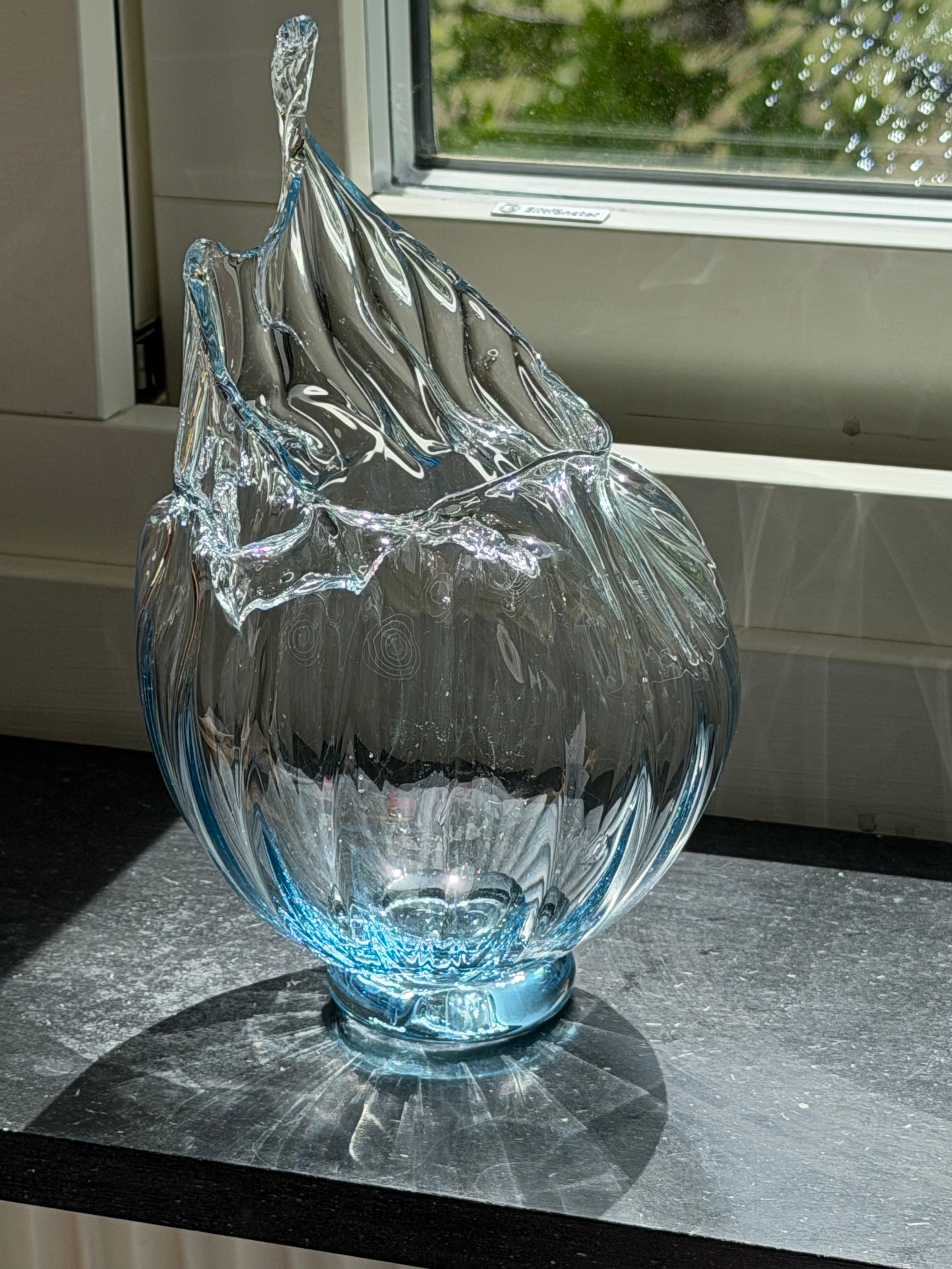 Sculptural glass vessel with a wave rim