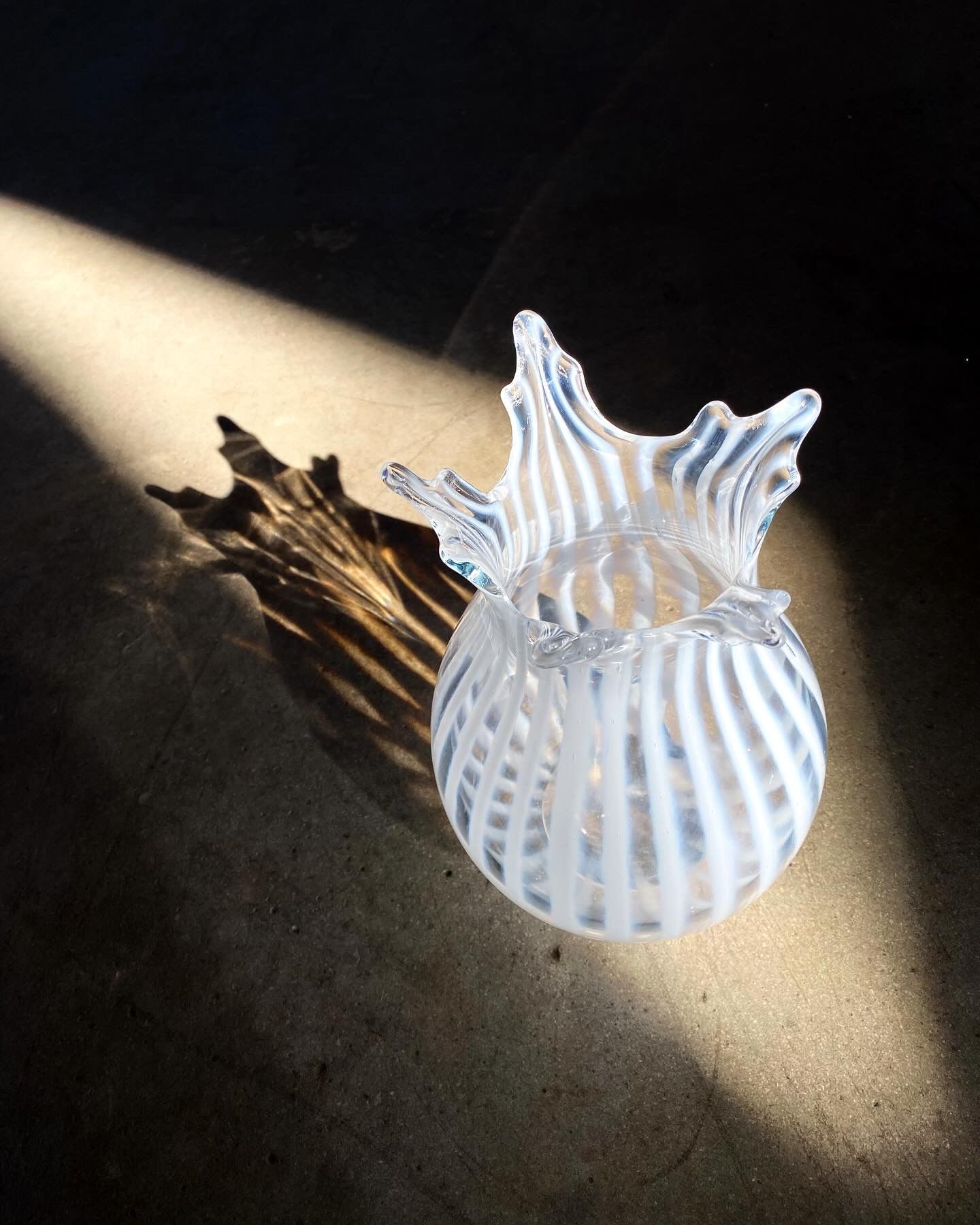 Crown vase illuminated by a sunbeam